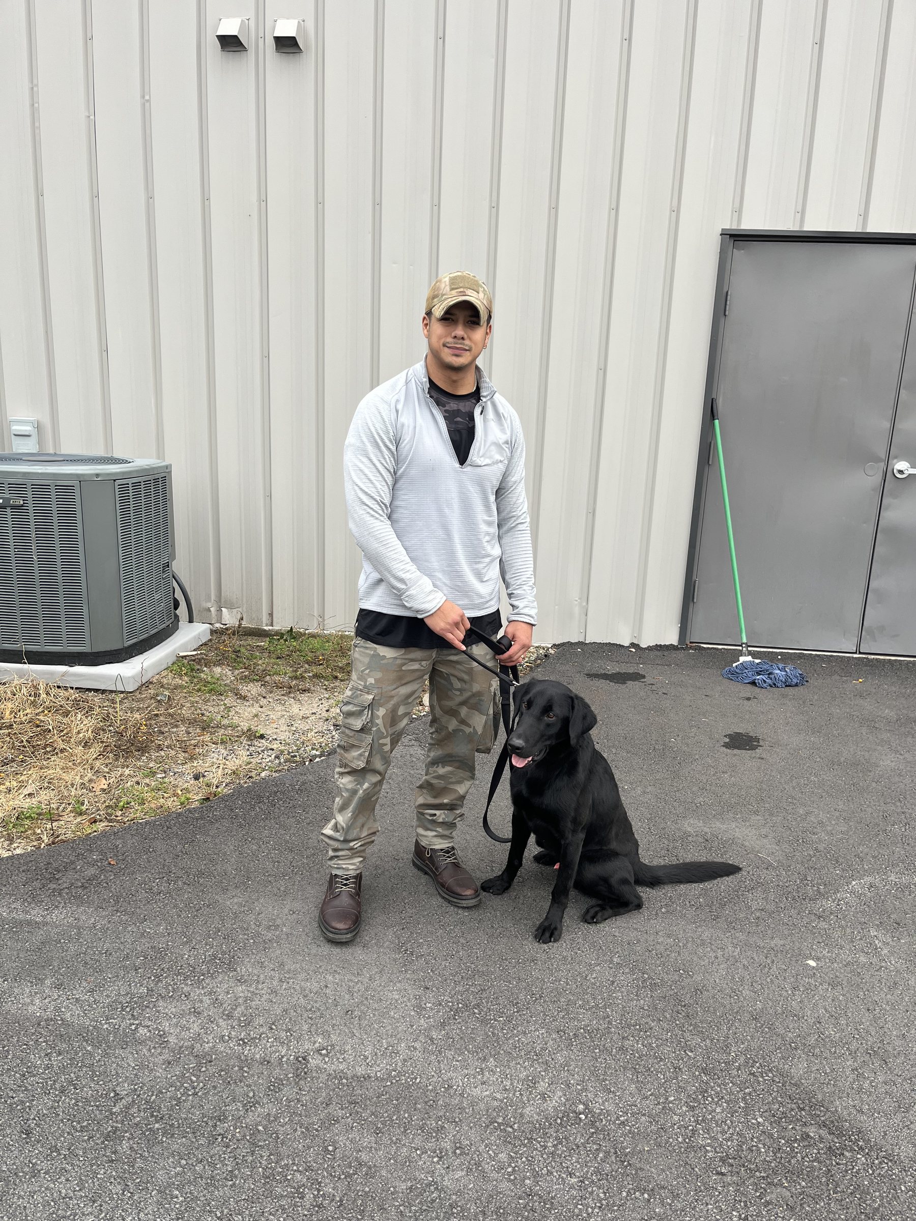 Codee Connects handler with dog in the field